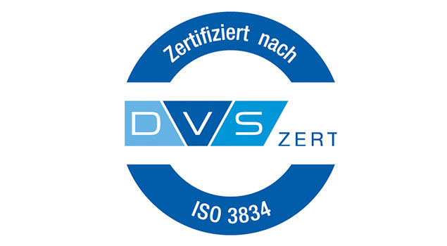 DVS ZERT Logo, blau und weiß, mit "Zertifiziert nach ISO 3834" in kreisförmiger Anordnung.